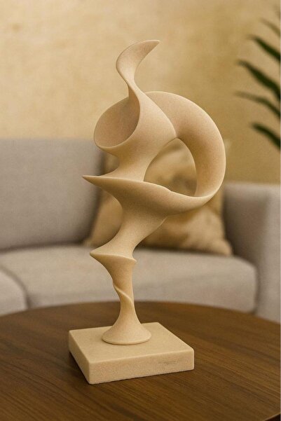 Oss elhetraf An abstract masterpiece with a sculpted design in light beige.