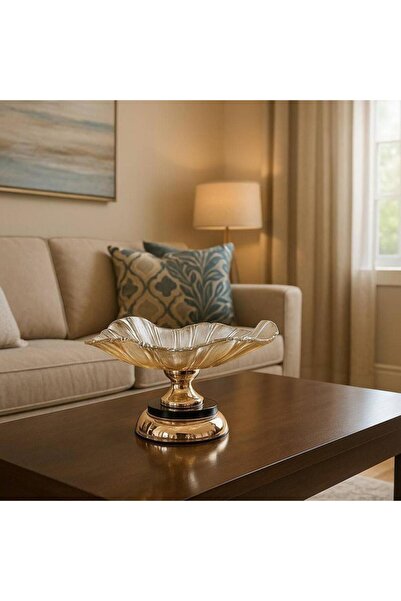 Oss elhetraf A luxurious gold crystal glass serving dish with a wave design