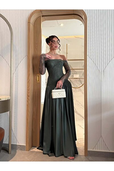 Shamouk An attractive, sophisticated, and elegant off-the-shoulder dress in an olive green color.