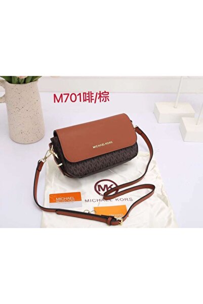 Generic A warm brown leather crossbody bag with embossed details and a long strap.