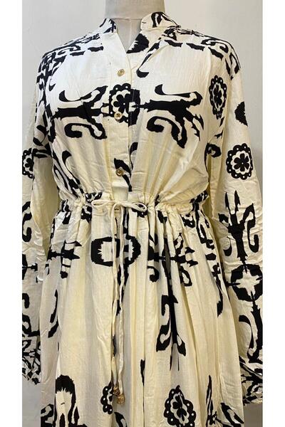 ISHRAQAT AL-AMAL Long dress (one size, free size) with long sleeves, elasticated cuffs, and front buttons.