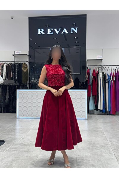 revan A luxurious, feminine, embroidered midi evening dress from Rivan.