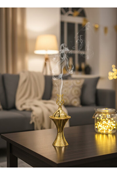 co arma A luxurious gold incense burner shaped like a kohl container