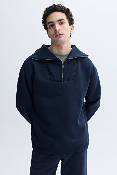 Mudo سترة رياضية فضفاضة بياقة عالية وسحاب مع تطريز