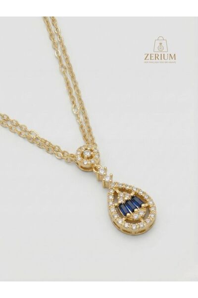 ZERİUM قلادة نسائية من الفولاذ باللون الذهبي والياقوت الأزرق موديل دامبل مودي...