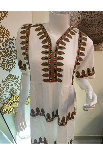 Veil Designer A luxurious women's jalabiya in a pure color, adorned with exqu...