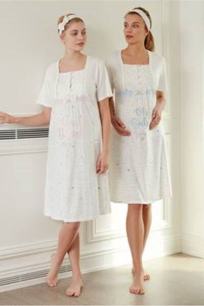 Stylish Elegant maternity dress adorned with buttons and a soft bow in pink