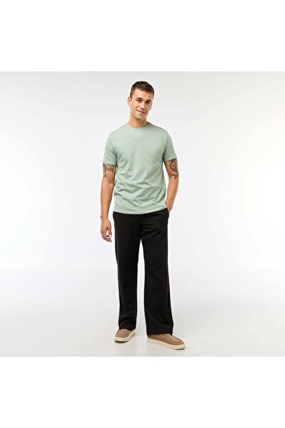 KIABI بنطلون تشينو واسع بلون أسود سادة