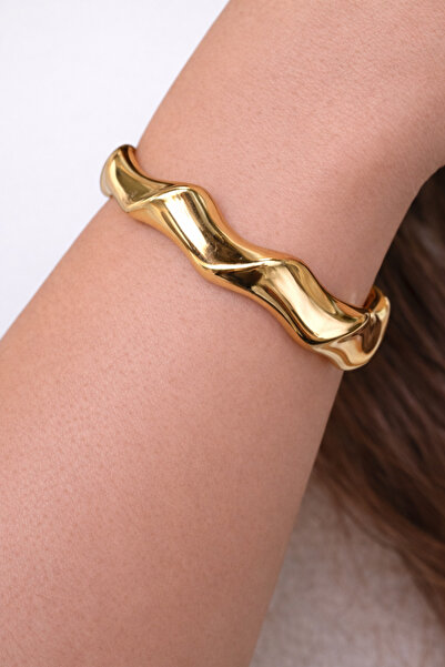 femline سوار نسائي عضوي على شكل موجة ذهبية اللون