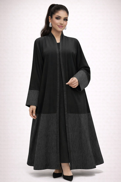 Elegant A black abaya in crepe fabric with jacquard, delivered with a headscarf.