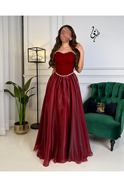 toog A long burgundy evening dress with shimmering embroidery and a luxurious...