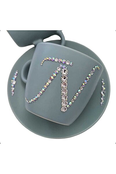 by Alexandra Vacarusi Turquoise cup and saucer set personalized with crystals...