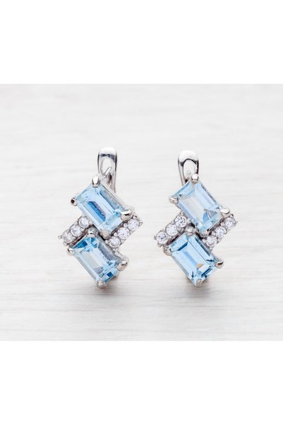 GÜMÜŞ DÜNYASI 925 AYAR Gümüş Rodyum Kaplamalı Kenaları Atom Beyaz Zirkon ve Baget Açık Mavi Topaz Taşlı Kadın KÜPE
