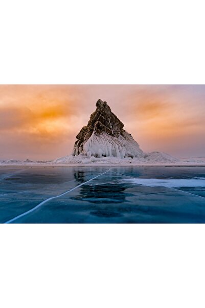 Zumzeria Tablou Canvas cu stânci acoperite de zăpadă și vedere la lac îngheța...