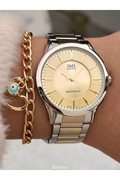 Q&Q ساعة يد نسائية من ماركة Q Q ذهبية اللون، سوار فولاذي، مقاومة للماء، تصميم...