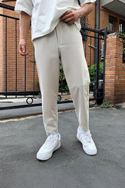 Flaw Wear بنطلون بتصميم بوي فريند من قماش المظلة بلون حجري