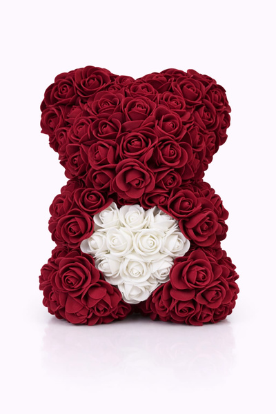 OEM Decorative teddy bear made of burgundy foam roses with a white heart in a transparent box