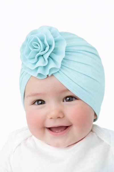 Pure Boutique Blue turban hat with flower applied to the front