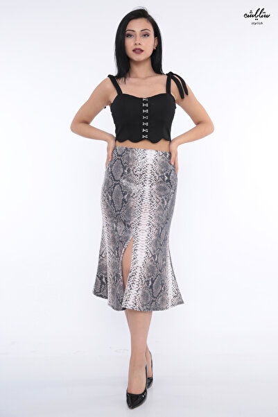 Stylish An elegant sequined skirt with a snakeskin design and a wide hem crea...