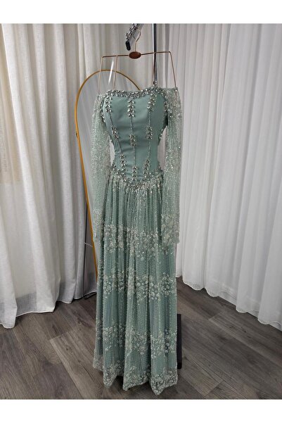 LAMSAT LATIN Elegant long evening gown in Tiffany blue, adorned with elaborat...