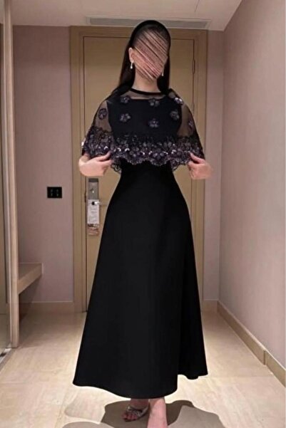 LAMSAT LATIN A long evening dress with a distinctive design: sheer tulle embr...