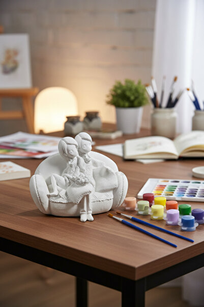 adanaçiçekliatölye SEVGİLİ HEYKEL MODELLERİ KOLTUKTA OTURAN ÇİFT