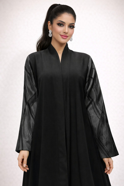 Elegant A crepe abaya with jacquard sleeves, delivered with a headscarf.
