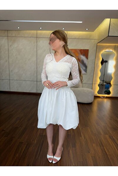 Generic A white dress with soft lace and an elegant, feminine cut.
