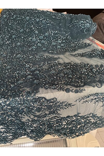 Butik zümrüt yeşili boncuklu kumaş