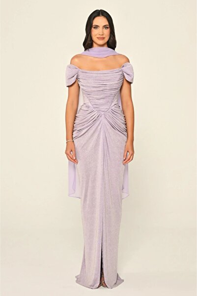 ALFABETA A shimmering evening gown with off-the-shoulder sleeves and an elega...