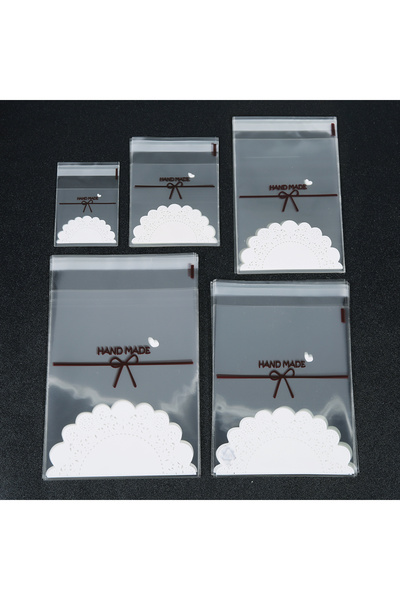 Choice أكياس بلاستيكية شفافة من مادة OPP، مقاس 7x7 سم، 100 قطعة/عبوة، ذاتية الإغلاق، مزينة بفيونكة دانتيل. أكياس تغليف هدايا المجوهرات.