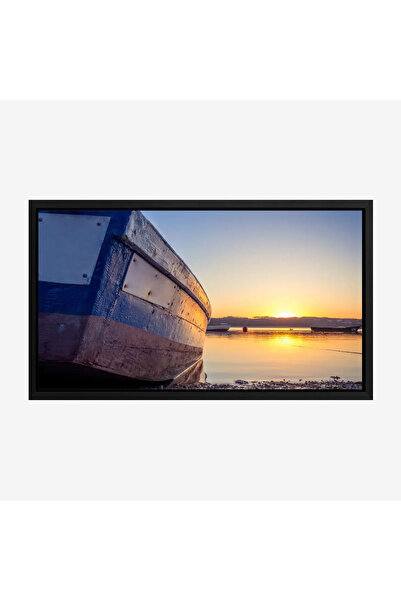 Tajridhome A nautical painting showing an old blue boat with a warm sunset and its reflections on the water, canvas.