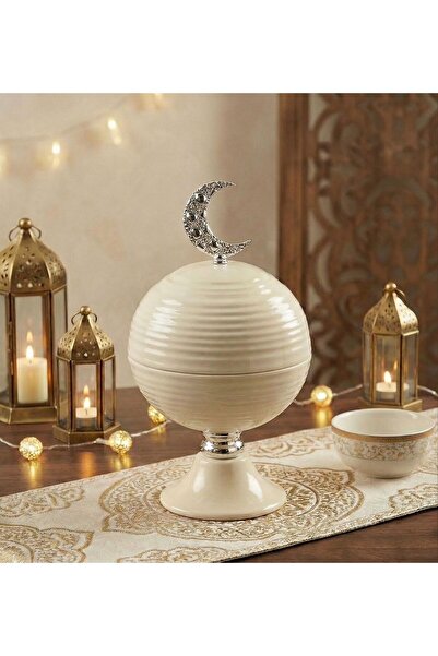 Noor A small, luxurious date-shaped tray made of iron, with an elegant Ramada...