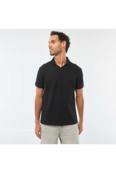 KIABI قميص بولو أسود قصير الأكمام من القطن البيكيه