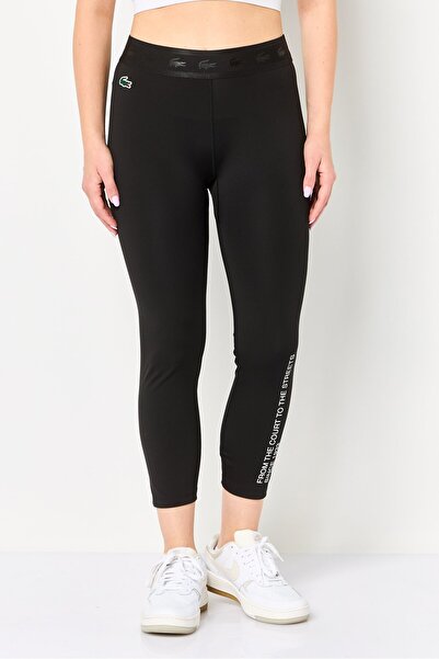 Lacoste بنطال ضيق بشعار العلامة التجارية للنساء، أسود