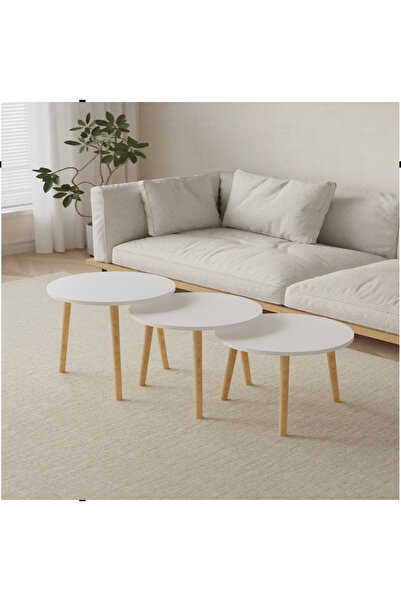 Un 3-piece round coffee table set with a modern design – white top and sturdy...