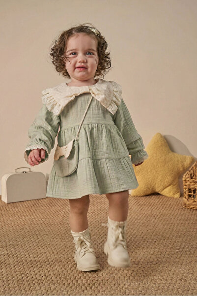 Minipodyum Fiyonk Detaylı Çantalı Bayramlık Müslin Kız Bebek Elbise