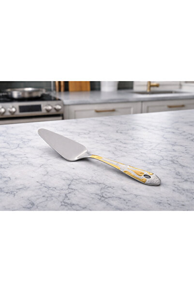 Dania A steel shovel with gold embellishments… a touch of luxury with every use