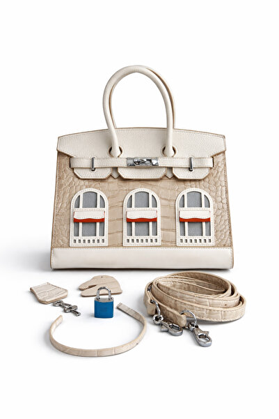 Evo A luxurious handbag with a distinctive architectural design, made from hi...