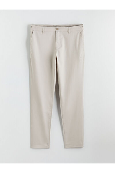 LC Waikiki قم بتكوين أسلوبك الخاص مع بنطلون تشينو رجالي ضيق باللون البيج من م...