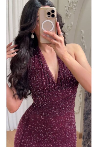 Kayla Long, fitted burgundy evening dress covered in beads
