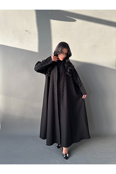 outline Limar flared abaya with an elegant trim and matching headscarf - a pe...