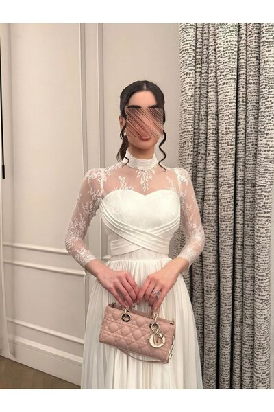 Ta Prince An elegant dress with a sophisticated design that combines softness...