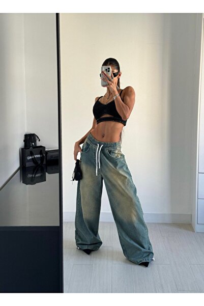 Alien 1979 Bel ve paça lastikli yeşil yıkamalı bol kesim kot pantolon