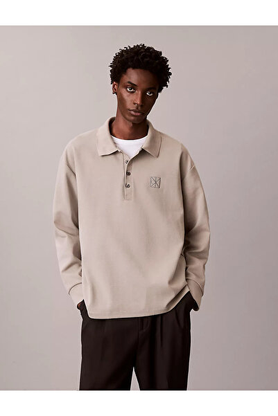 Calvin Klein تي شيرت رجالي مريح بتصميم مريح مطرز بشعار CK من القطن بأكمام طوي...