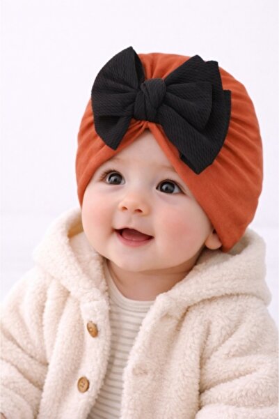 Pure Boutique Baby turban hat in brick color with black bow, Stretch Fabric f...