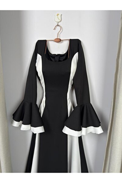 NO BRAND A stylish dress with a modern design that combines black and white