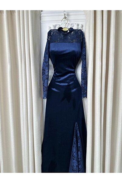 ALSAMAHA A navy blue velvet dress with elegant and sophisticated lace.