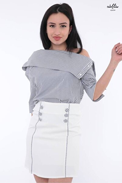 Stylish An elegant tailored suit featuring a black and white striped blouse w...