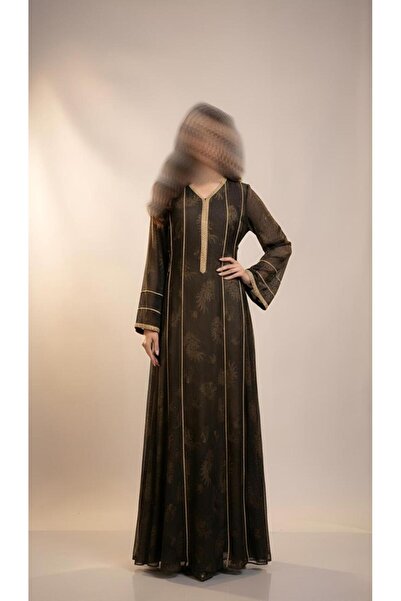 ISHRAQAT AL-AMAL A long dress with long, slightly wide sleeves, decorated wit...